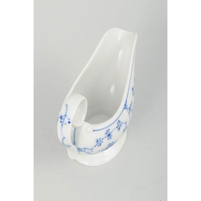 Royal Copenhagen Blue Fluted Plain, model 1/308 sauce boat. Classic sauce boat in the “Blue Fluted Plain” porcelain...
