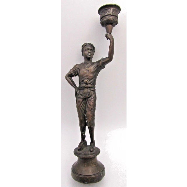 Matched Pair of Vintage Boho Patinated Bronze Boy Torchbearer Candle Holders Each measures 6" wide, 2 3/8" deep and 10...