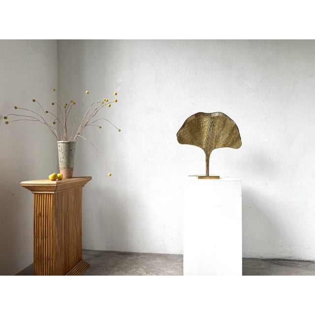 Maison Lecan presents this 2000s brass-plated metal desk lamp, reminiscent of the Ginkgo lamps designed by Tommaso Barbi...