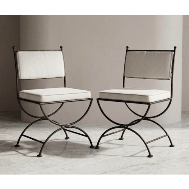 Elevate your outdoor oasis or sunroom with this striking pair of vintage cast iron patio chairs, masterfully crafted in...