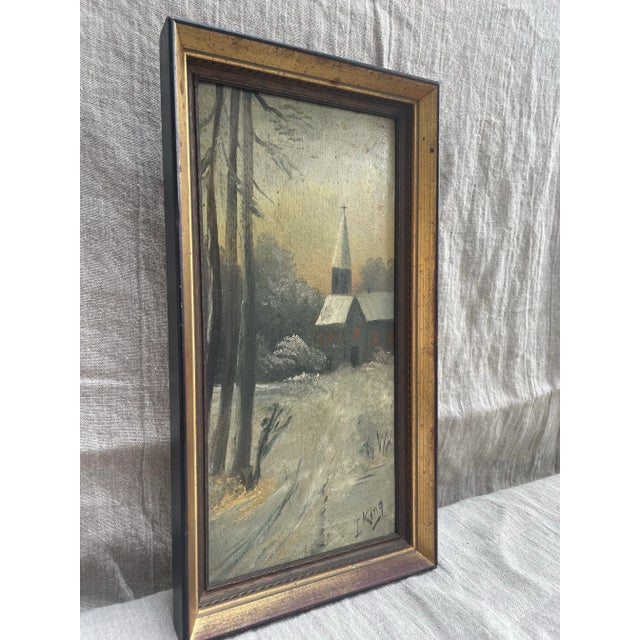 A serene winter landscape, this oil on board painting signed L. King captures the quiet beauty of a snow-covered country...