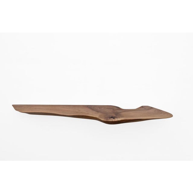 W2393 wall hanging shelf in walnut wood by jörg pietschmann dimensions: d 27 x w 140 x h 5 cm. Materials: walnut wood. All...