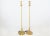 A fine pair of 1940's Art Deco torchères / floor lamps. Features a quarter dome rounded base. Solid brass with rings and...