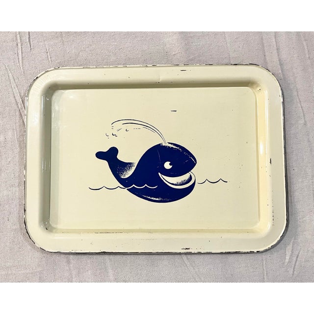Mid century metal whale tray. Blue cartoon whale on cream background. A great retro nautical New England accent piece....