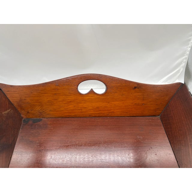 English, late 18th to early 19th century. This fine quality mahogany tray is a very unusual form. The edges with a...