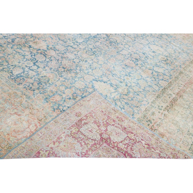 Beautiful vintage Persian Kerman hand-knotted shabby chic wool rug with a navy blue field. This piece has a burnt orange...