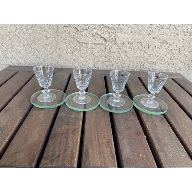 These are antique French crystal sherry or port glasses, featuring a distinctive "Caton" pattern characterized by faceted...