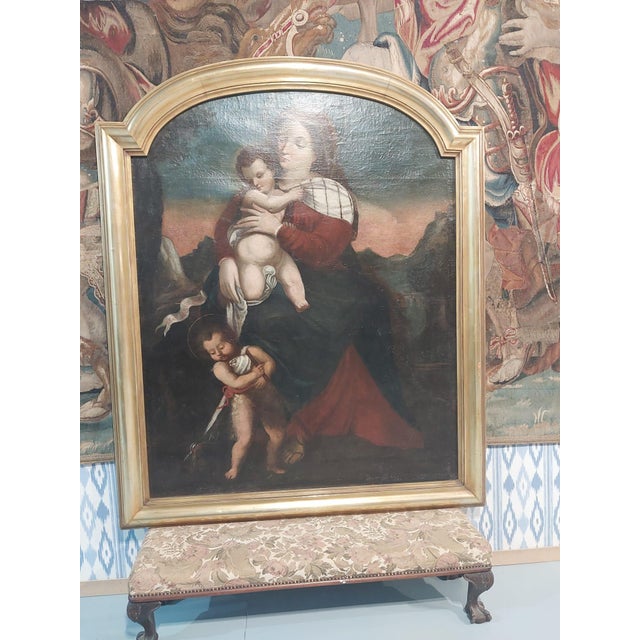 A beautiful late 17th-century oil on canvas depicting the timeless devotional subject of the Madonna and Child with the...