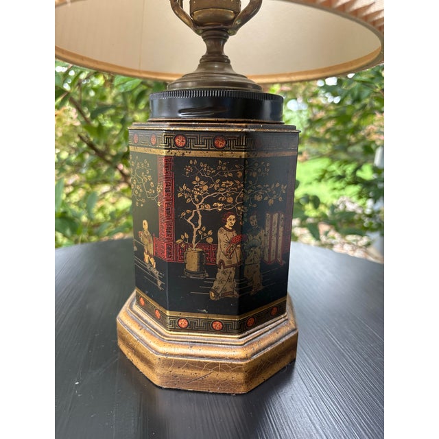 Vintage Frederick Cooper table lamp featuring a striking hexagonal Chinoiserie body finished in black with intricate gilt...