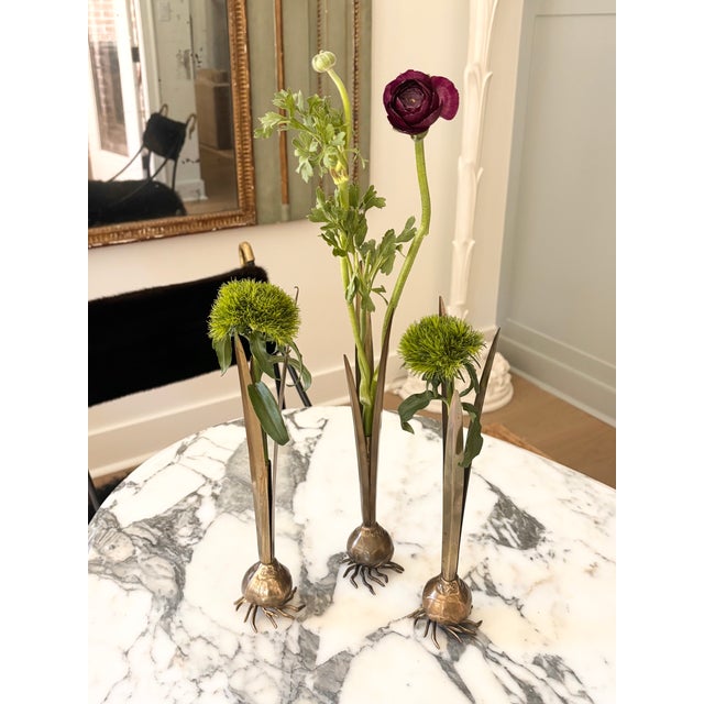 Whimsical set of 3 vintage brass botanical bud vases/sculptures. Each sculptural vase is fashioned in the form of a...
