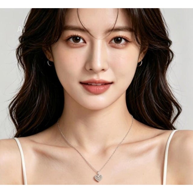 Elegant 14K white gold pendant necklace featuring a heart design set with natural brown, champagne, and white diamonds...
