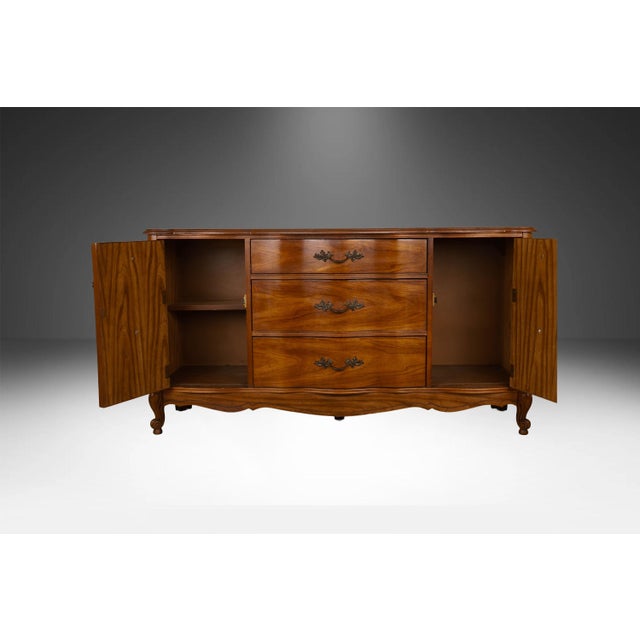 Beautiful vintage French Provincial style triple dresser / sideboard buffet by Bassett circa 1960’s. Featuring a...