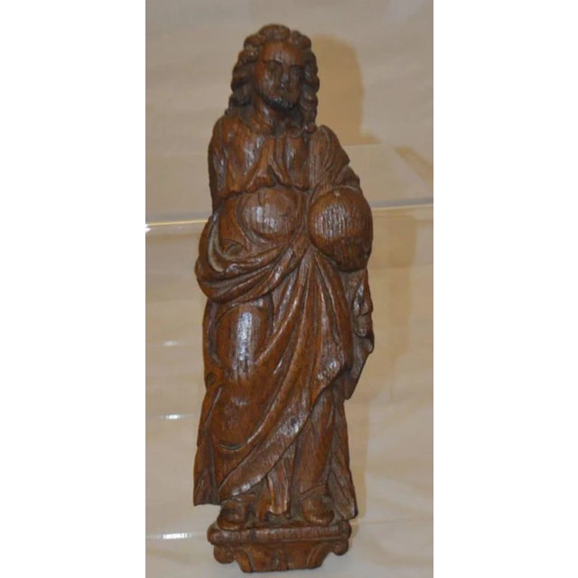 A bas-relief Salvator Mundi, Christ holding an orb, Measures: H. 15-1/4", W. 5". Hand carved walnut.
