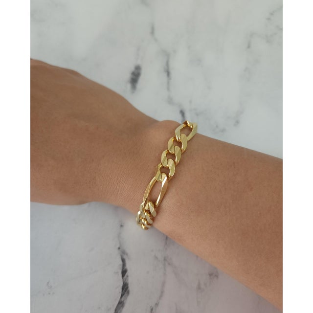 ♥ Product Summary ♥ Details: Figaro Chain Metal: 14k Yellow Gold Weight: 29 grams Length: 7.5 inches Width: 9mm