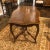 Antique hand-carved and shaped center table with book matched walnut top. The beautifully carved apron features a drawer...