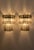 DUTIES FREE An exceptional pair of Italian Murano glass wall sconces featuring a striking starburst composition of...