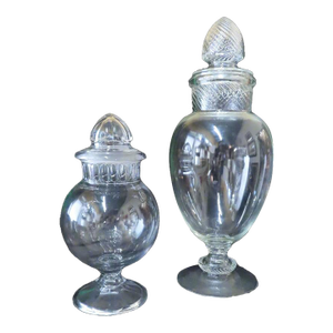 Two Large Glass Apothecary Jars With Fun Lids