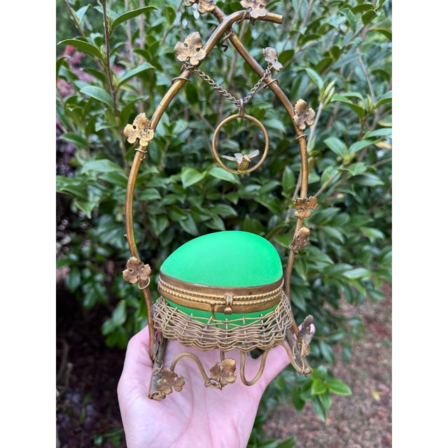 An exceptional and highly decorative antique French egg-form casket in vibrant uranium opaline glass, presented within an...