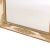 A handsome French Louis XVI style mirror featuring a cream-painted frame richly embellished with finely detailed parcel-...