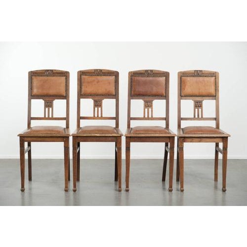 We are offering this set of 4 antique oak dining chairs in the Art Nouveau style, upholstered in sheepskin. Thanks to...