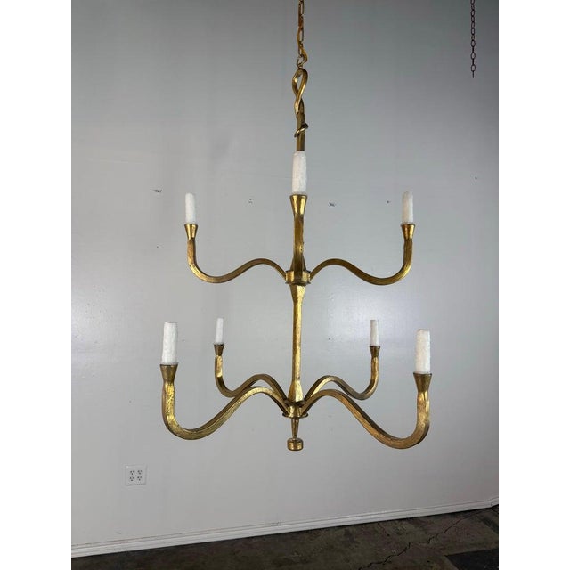 The Benedict chandelier by Miamar Home is a refined two-tier, eight-light fixture, handcrafted and finished in radiant,...