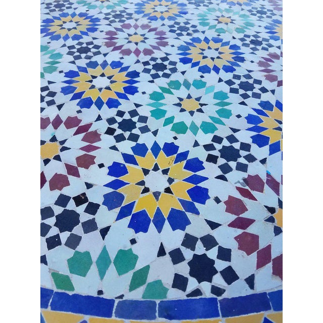 Multicolor custom-made Moroccan mosaic table measuring 48" in diameter. An indoor / outdoor dining table that sits up to...