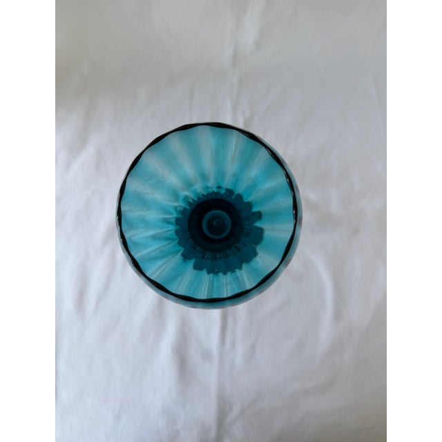 Vivid Peacock blue/Teal Ribbed Optic Italian Empoli on a 6 inch stem. Shines beautifully in the sunlight. Very unique...
