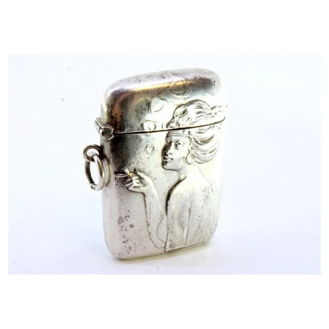 Art Nouveau Silver Matchbox with Relief Figure of Smoking Lady, in Very Good conditions. Designed from 2000 This piece has...