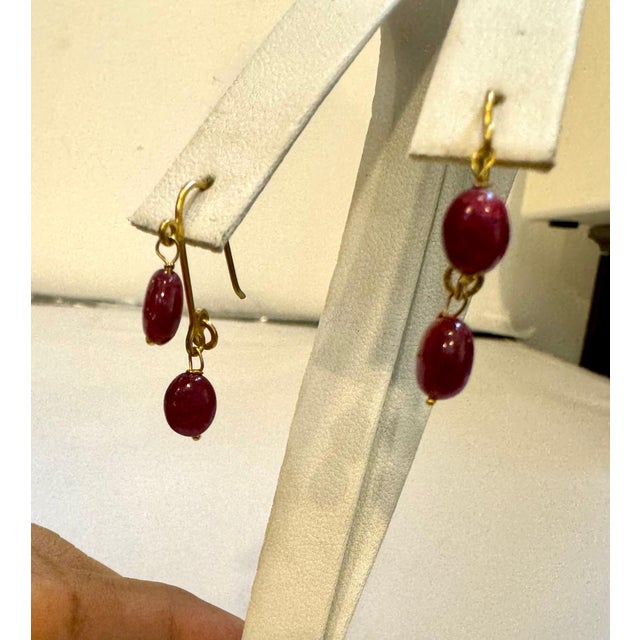 Approximately 85 Ct Natural Ruby Bead Single Strand Necklace with 5 ruby beads hanging from a 22 Karat Gold Chain and...