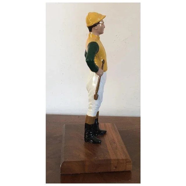 Iron Desk Top Statue of a Horse Jockey Dressed in Silks, Cap, Jodhpurs, Boots and Carrying a Riding Crop Mounted on Mahogany Base Door Stop For Sale In New York - Image 6 of 10