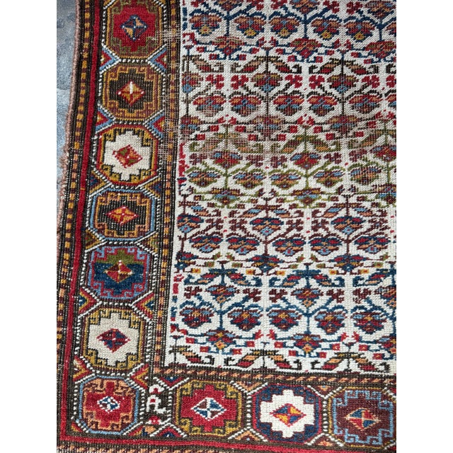This exquisite vintage Persian Bijar rug is a masterpiece of dense weave and bold design, featuring a classic Herati...