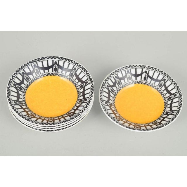 Royal Worcester Set of five small bowls, 1920s. Five small faience bowls with a yellow centre and a decorative black-and-...