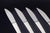 Henning Koppel for Georg Jensen, set of four dinner knives Caravel. Set of four dinner knives in stainless steel and...