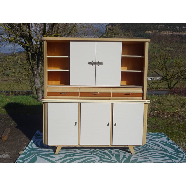 Two-piece kitchen buffet by Weiler, made in Alsace, France, in the 1960s. Lower section: three-door sideboard on wooden...