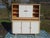 Two-piece kitchen buffet by Weiler, made in Alsace, France, in the 1960s. Lower section: three-door sideboard on wooden...