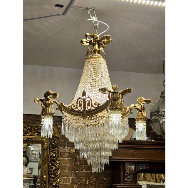 Bring timeless European grandeur into your home with this magnificent Empire-style crystal chandelier. Featuring an...