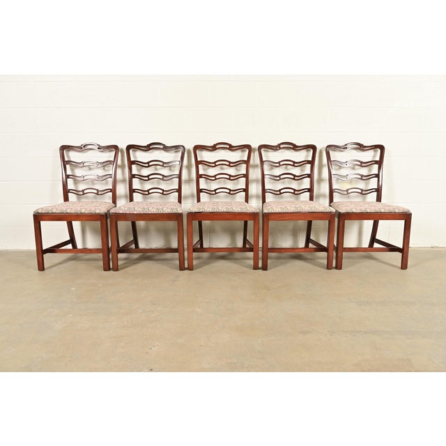 A gorgeous set of five Georgian or Chippendale style dining chairs In the manner of Baker Furniture USA, Circa Mid-20th...