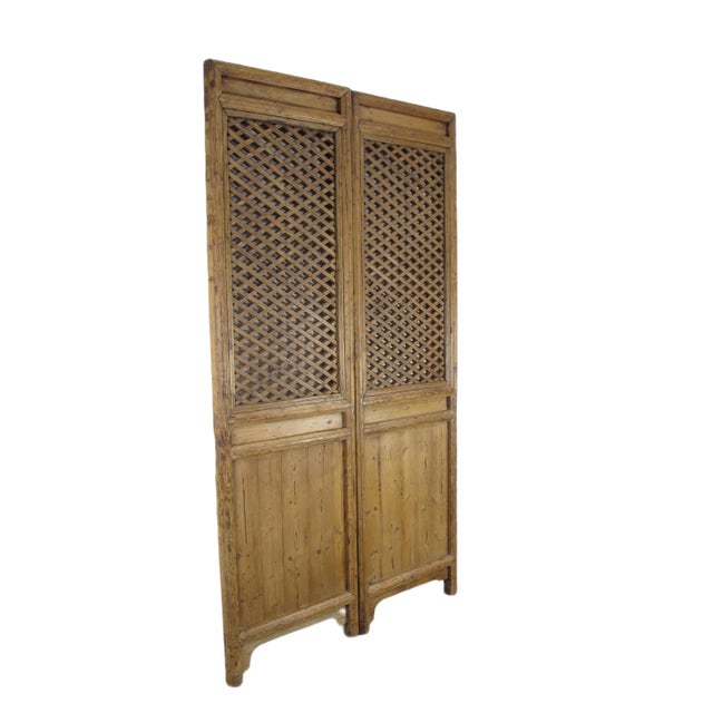 The restoration to this set of 2 antique Chinese panel screens is intentionally kept minimum. A set of 2 panel screens...