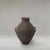 Antique Berber unglazed clay storage jar from Morocco, dating from the early 20th century, with a rounded utilitarian form...