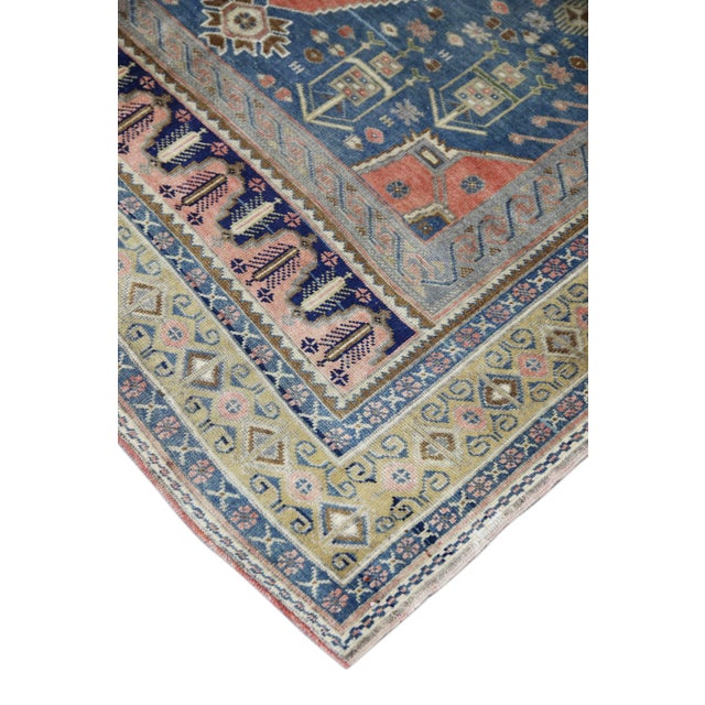 Introducing a one-of-a-kind vintage Turkish hand-knotted wool rug, carefully crafted by skilled artisans using traditional...