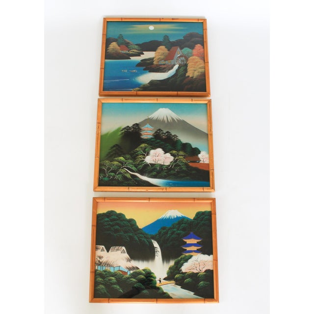 Set of three vintage, hand-painted Japanese landscape artworks on silk featuring Mount Fuji, cherry blossoms, waterfalls,...