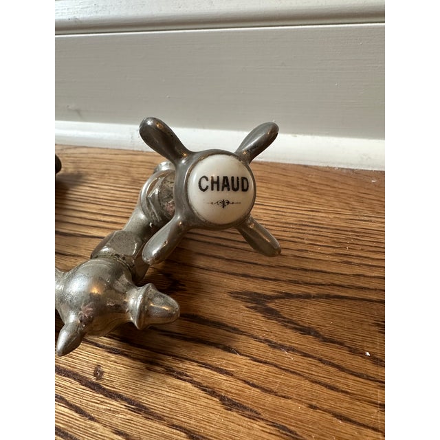 Charming antique faucet with labeling in French. Measurements and condition shown in photos. No markings found except for...
