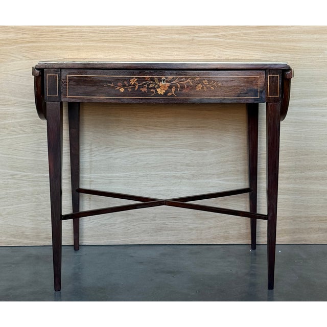 This is an outstanding example of a late 19th century late Louis XVI-style small writing table. The beautifully figured...