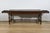 This large oak farm table opens at the waist with two side drawers with drop iron handles. The whole rests on turned legs,...
