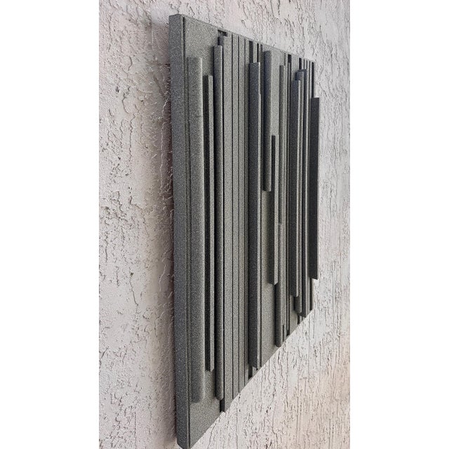 Lines of Stone Grey Hank Hecht Wood Assemblage Wall Sculpture, 2002 Offered for sale is a striking wooden assemblage that...