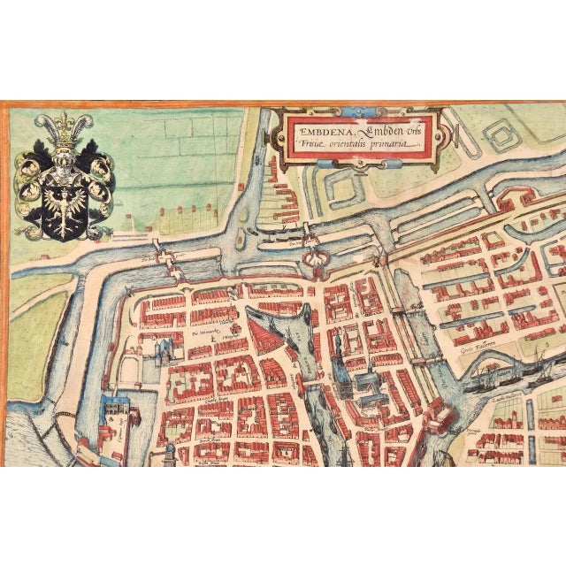 This is a 16th century original hand-colored copperplate engraved map of a bird's-eye View of Embden, Germany entitled "...