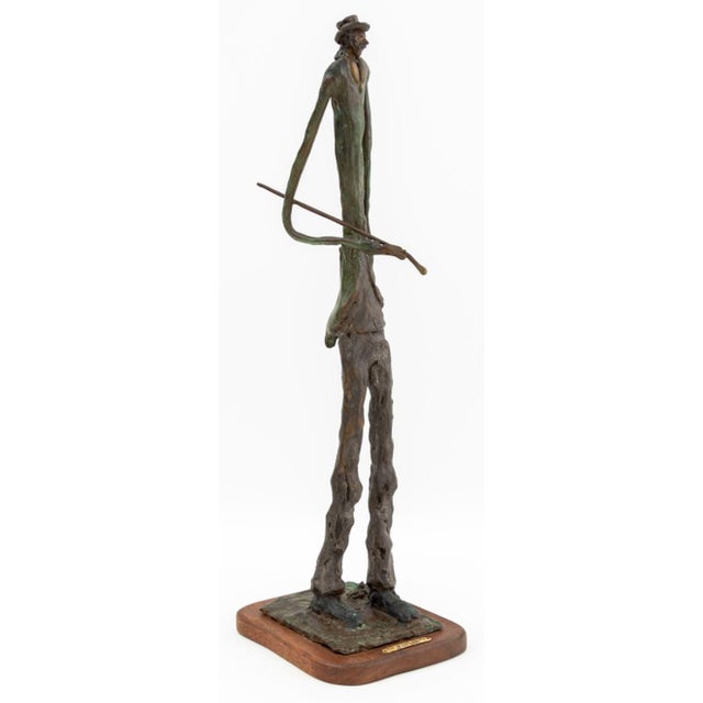 Ray Niegel (American, XX) "Sunday Walk" Patinated Bronze Sculpture, 1987, depicting a gentleman with a cane tucked under...