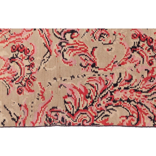 This exceptional vintage Bessarabian rug from the 1960s is a striking example of Eastern European textile artistry,...