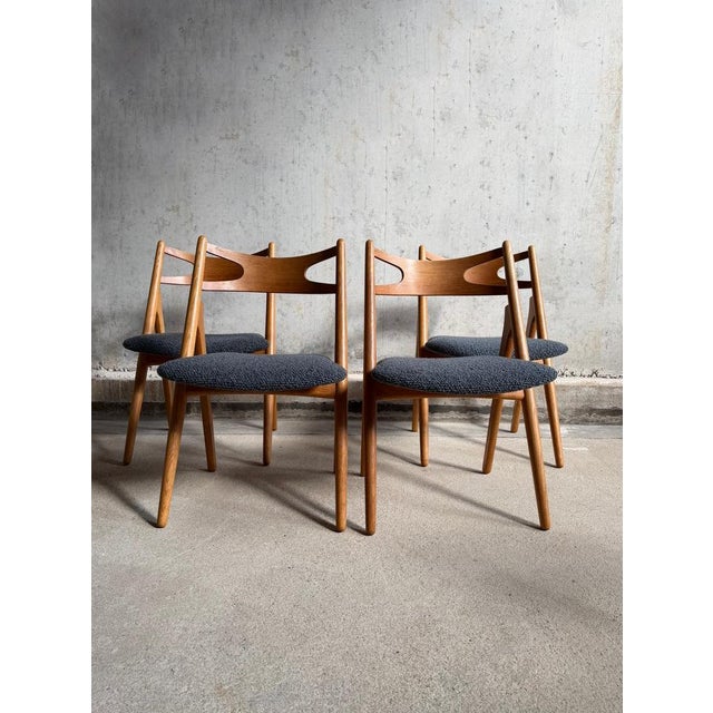 Set of 4 early sawbuck chairs model CH29 designed by Hans J Wegner for Carl Hansen & Son, Denmark 1952. The frames of the...