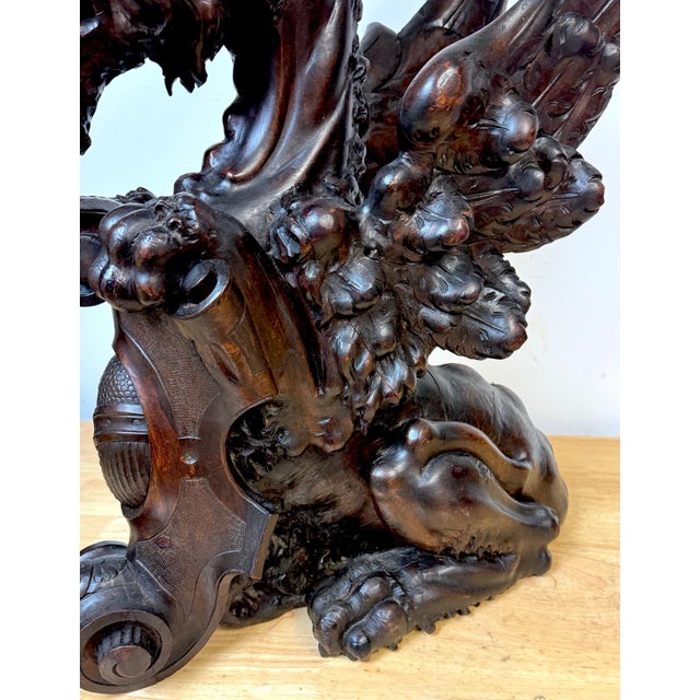 Large Pair of 19th C. Carved Mahogany Heraldic Winged Griffins, Attributed to the workshop of R.J. Horner & Co. Presenting...